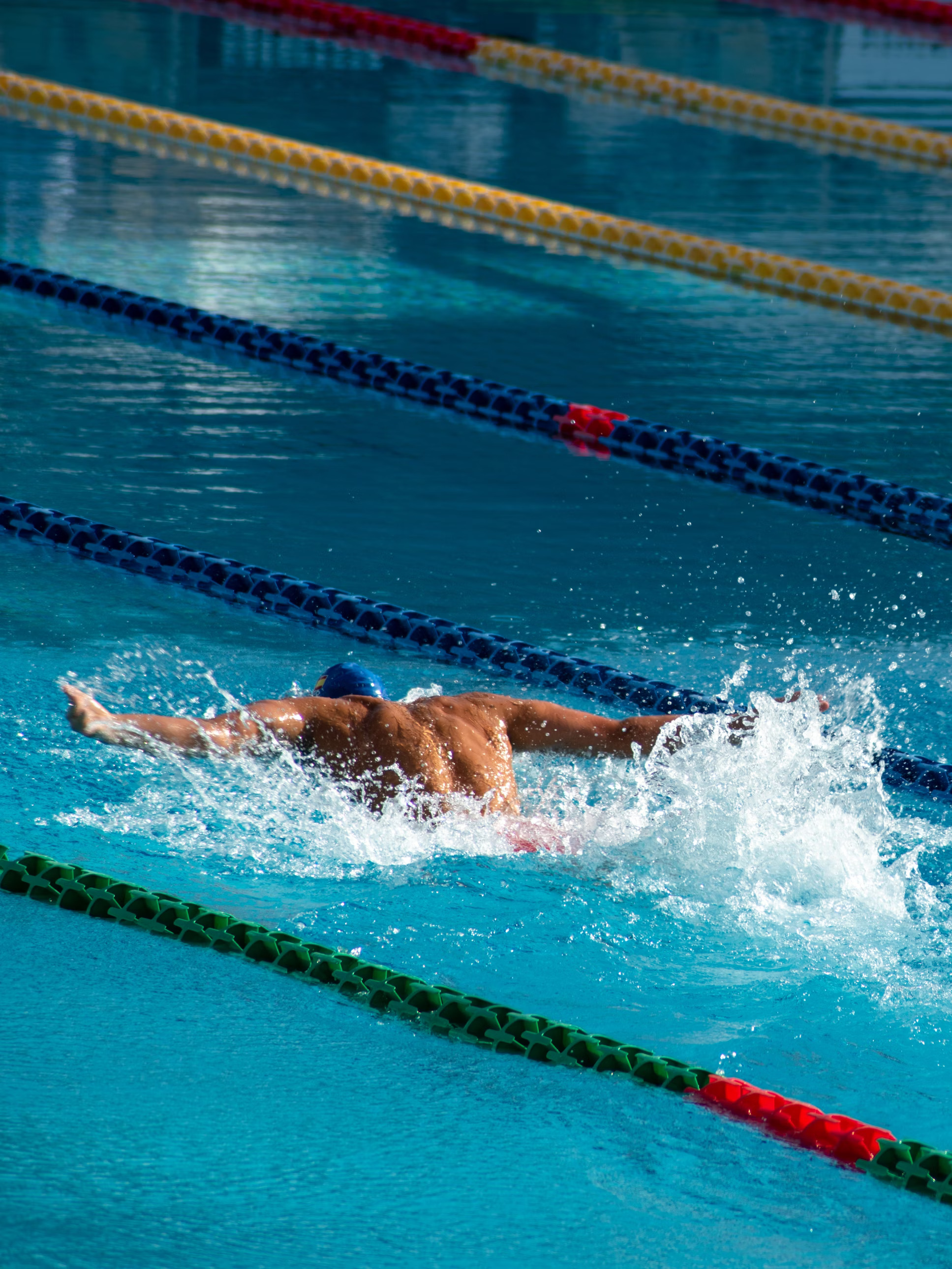 Students practicing swimming in a pool