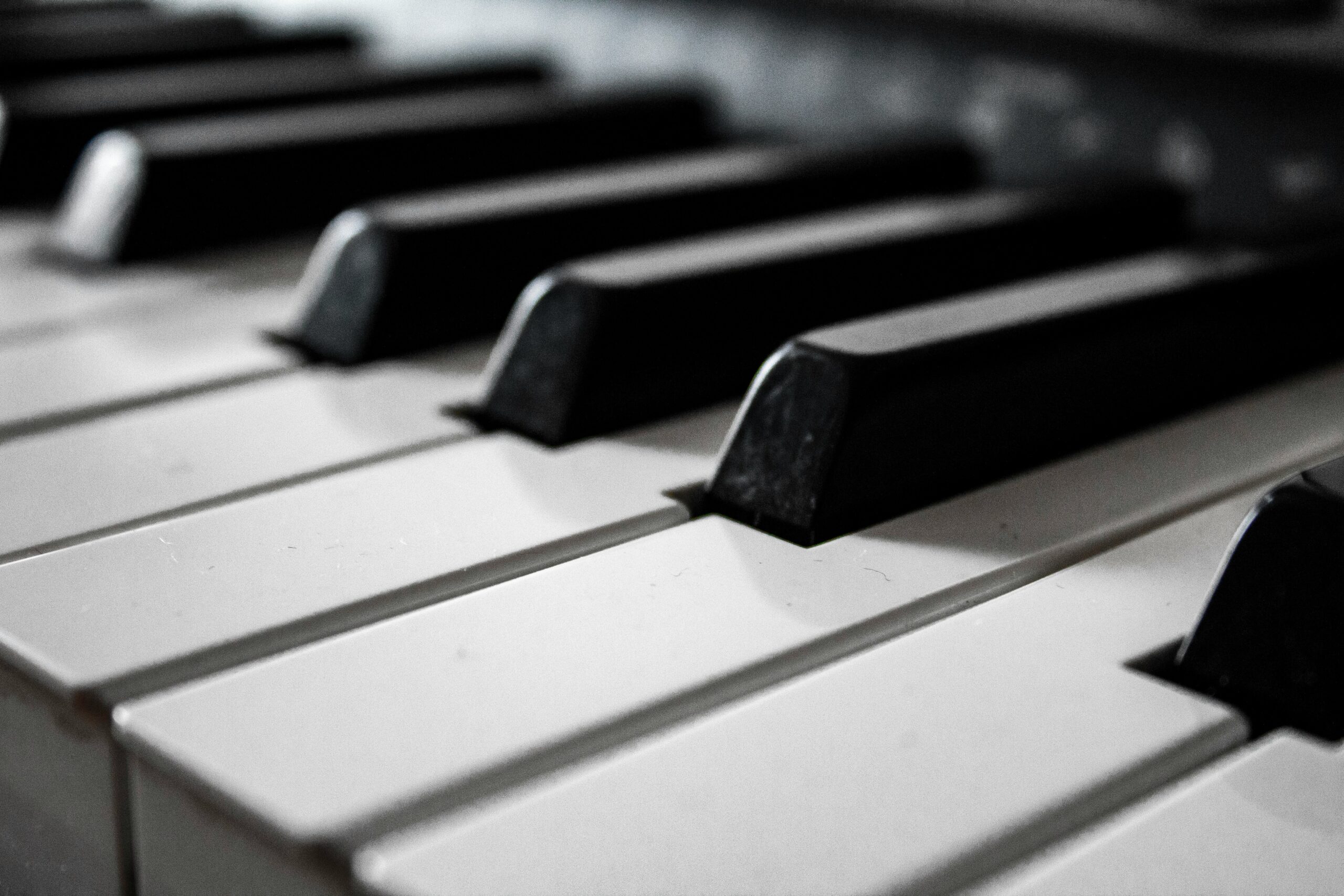 Student playing a keyboard in a music class