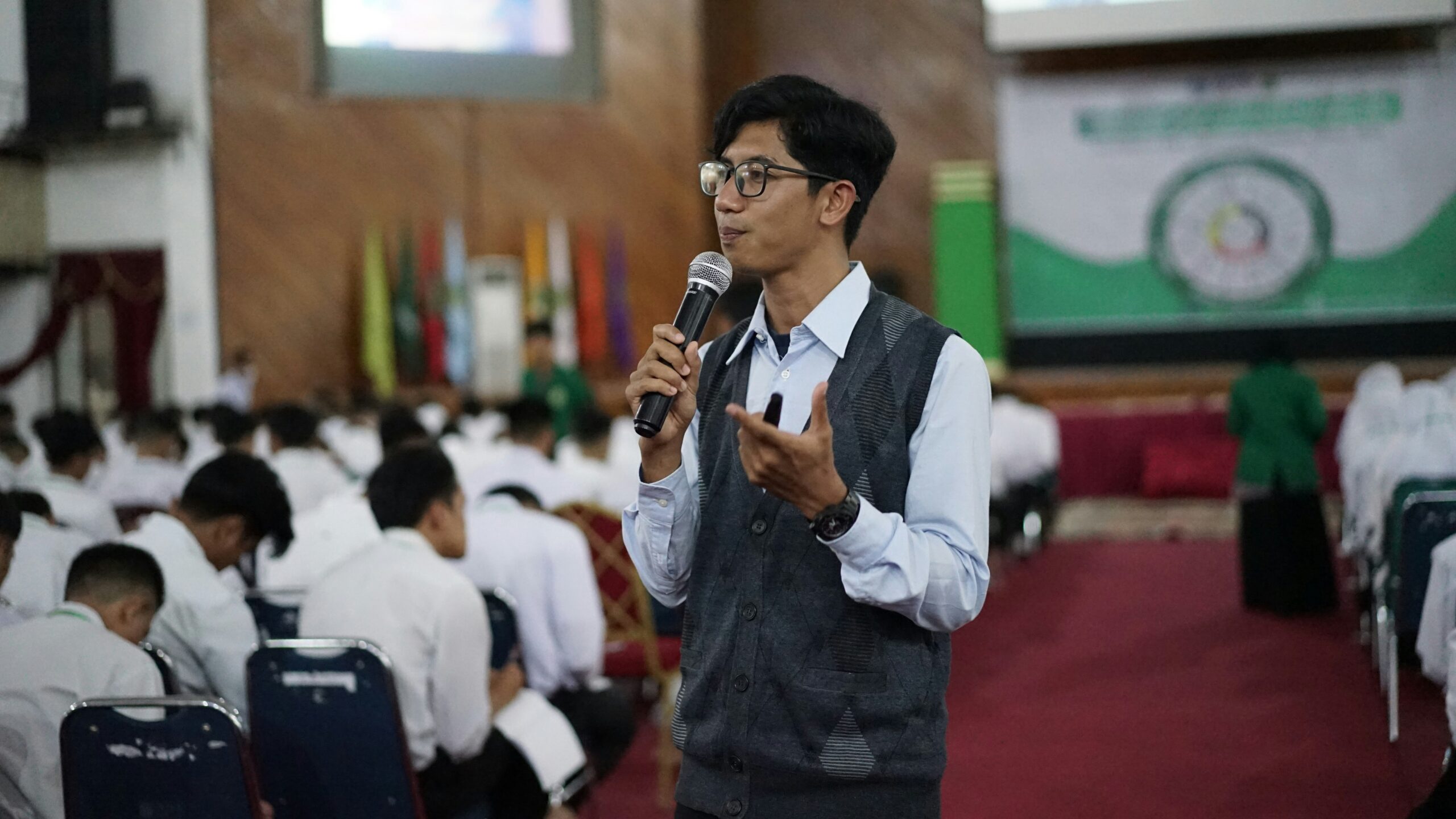 Student delivering a public speech at an event
