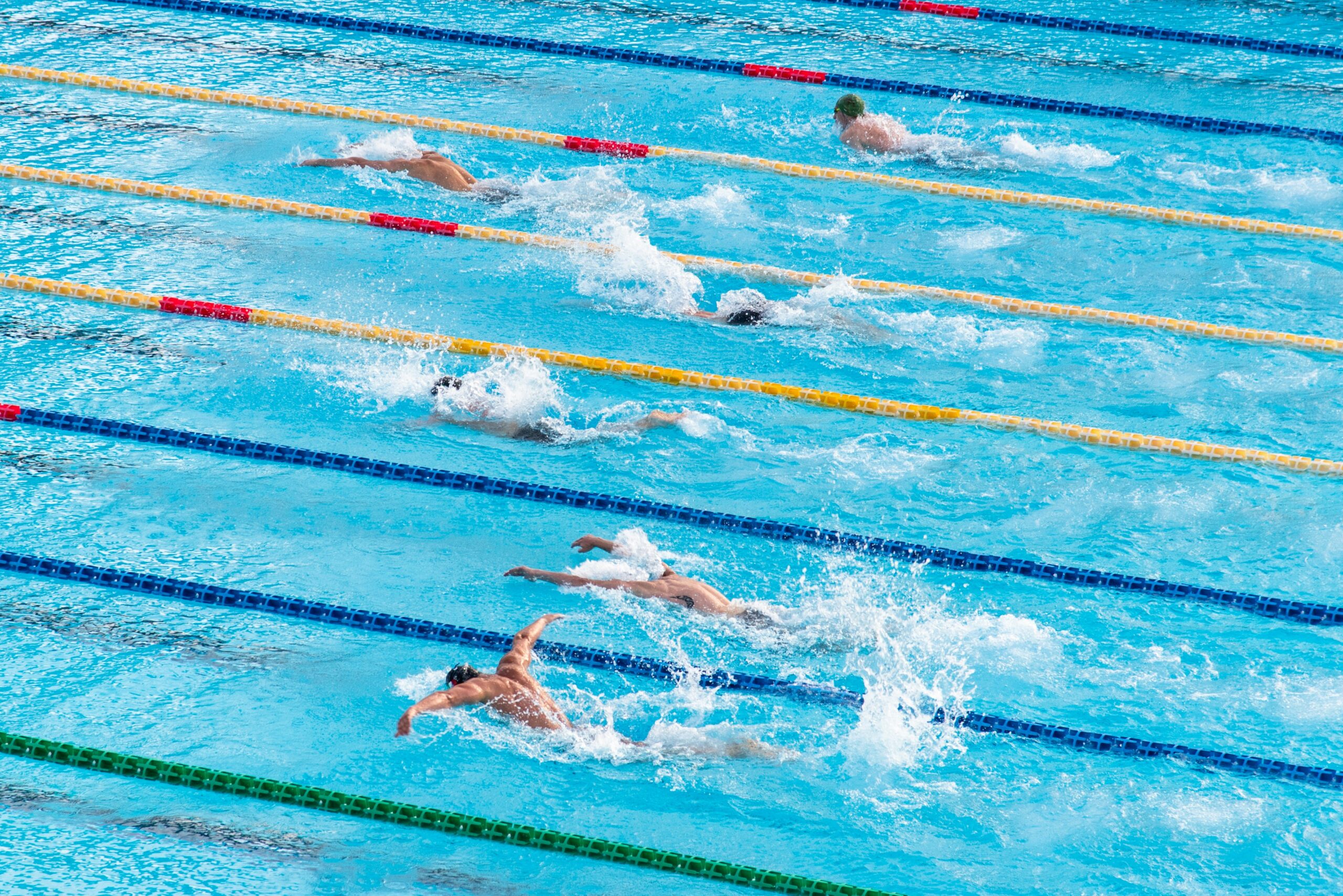Students practicing swimming in a pool